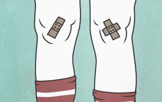A cartoon drawing of knees covered in band-aids, with striped knee socks